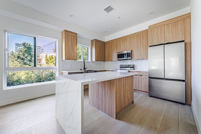 Building Photo - Modern 4-Bedroom Townhome-Style Living in ...