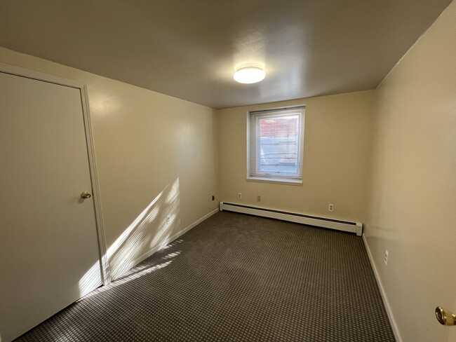 smaller basement bedroom with new windows - 1299 Harpst St