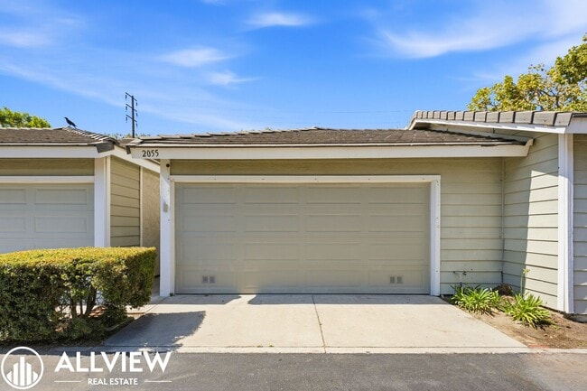 Building Photo - Fully Renovated 2 Bed Townhome with Private Patio, 2-Car Garage & Community Pool