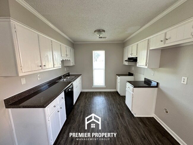 Building Photo - Charming 3BR/2BA Near Southwind | High Vaulted Ceilings, Hardwood Floors & Fireplace