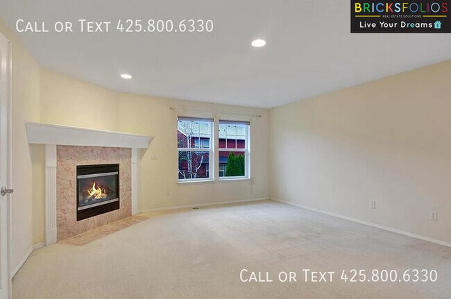 Building Photo - Dream Kitchen, Dual Fireplaces: Find Your Stylish Sanctuary in Redmond Ridge.