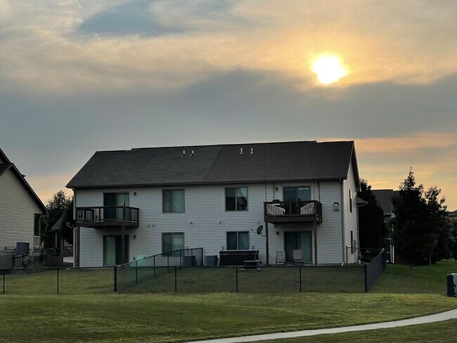Back of the house, fenced in yard with a fire pit. (house on the right ** hot tub not included** - 482 Watts Ct