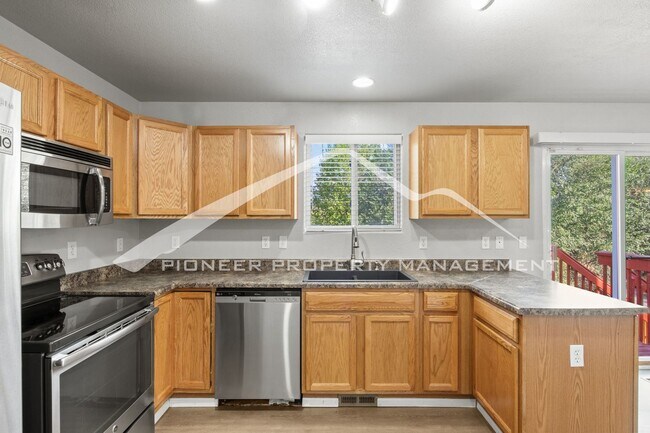 Building Photo - Spacious 4-Bed, 3.5-Bath Home with Walkout Basement, Oversized Deck enclosed yard, AC and 2-Car G...