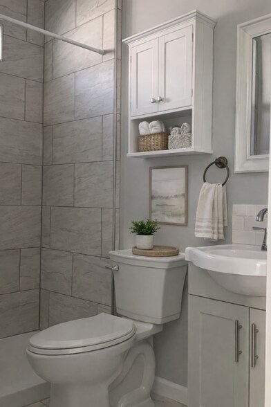 COntemporary bathroom with wal-in tiled shower, modern vanity and clean finishes. - 262 Soledad St