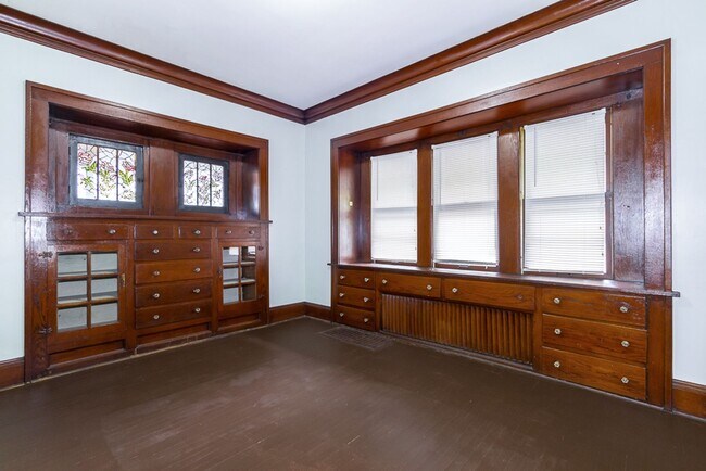 Building Photo - Charming 3BR Home with Classic Woodwork, Porch & Bonus Attic Space