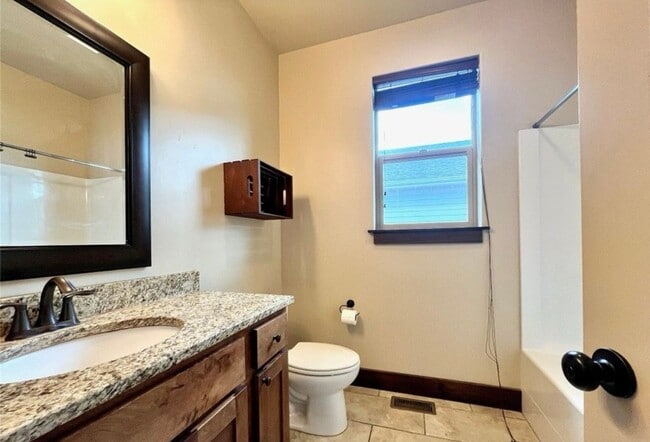 Building Photo - Charming 4-Bedroom Home with Spacious Lawn...