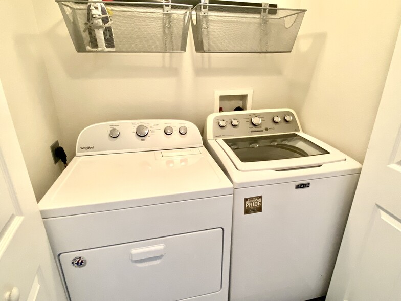 See through washer with no agitator; full size dryer are tucked away inside your condo! - 1025 Villagio Cir
