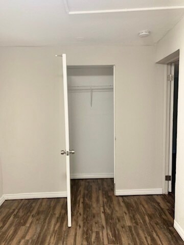 Explore the elegance of this bedroom, complete with a spacious closet and modern flooring. - Barnum Park