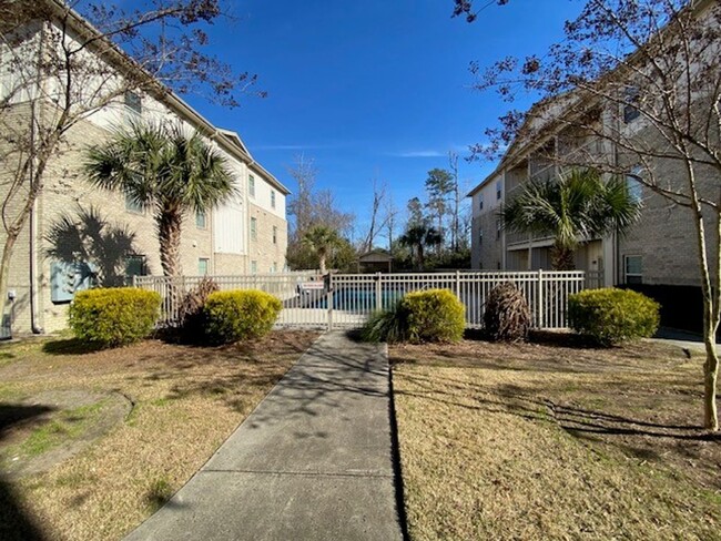 Building Photo - Welcome to this stunning 1st floor condo l...