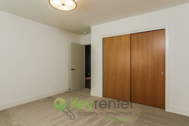 Building Photo - Spacious Living with Balconies, Deck, and Private Yard