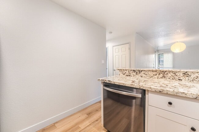 Building Photo - Upgraded Three-Bedroom Condo with Wood Flooring and Modern Comforts!