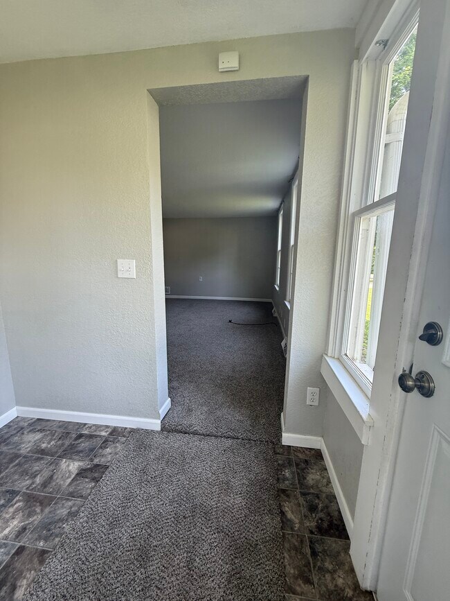 Entry room off the living room. excellent for keeping those muddy shoes off your floors! - 529 S Gault St