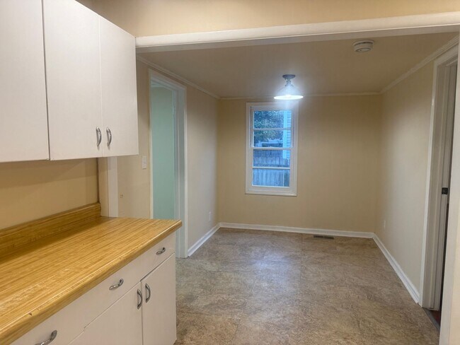 Building Photo - Step into this beautifully updated 1950's gem, where charm meets modern convenience